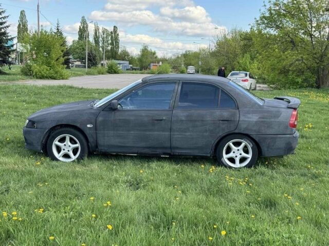 Чорний Міцубісі Lancer, об'ємом двигуна 0.18 л та пробігом 246 тис. км за 1250 $, фото 3 на Automoto.ua