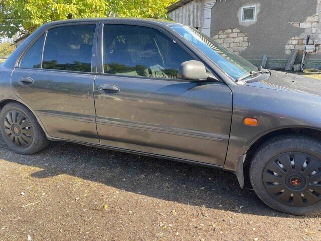 Чорний Міцубісі Lancer, об'ємом двигуна 1.3 л та пробігом 350 тис. км за 2300 $, фото 7 на Automoto.ua