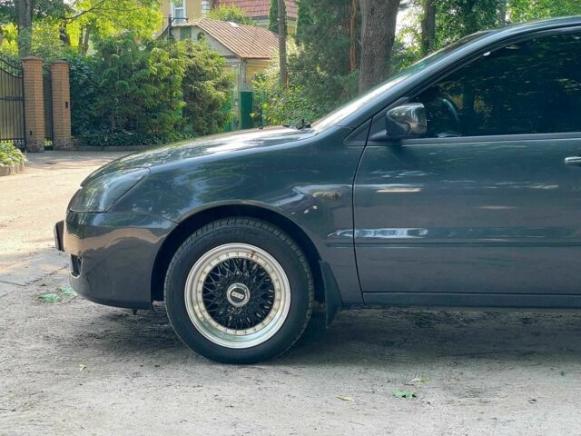 Чорний Міцубісі Lancer, об'ємом двигуна 1.6 л та пробігом 270 тис. км за 6490 $, фото 10 на Automoto.ua