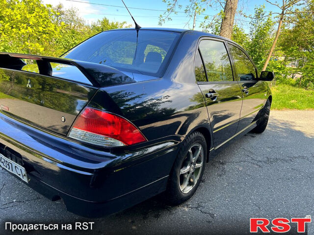 Чорний Міцубісі Lancer, об'ємом двигуна 2 л та пробігом 208 тис. км за 2900 $, фото 12 на Automoto.ua