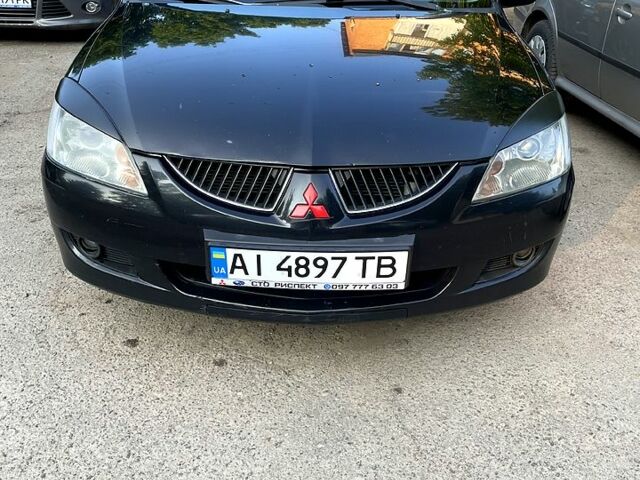 Черный Мицубиси Лансер, объемом двигателя 1.6 л и пробегом 280 тыс. км за 3000 $, фото 2 на Automoto.ua