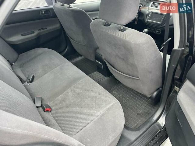 Чорний Міцубісі Lancer, об'ємом двигуна 1.58 л та пробігом 290 тис. км за 3900 $, фото 20 на Automoto.ua