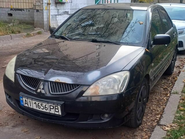 Черный Мицубиси Лансер, объемом двигателя 1.6 л и пробегом 218 тыс. км за 3200 $, фото 1 на Automoto.ua