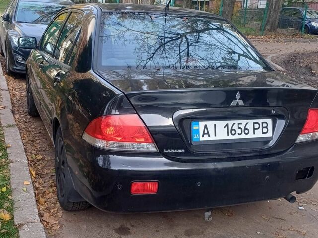 Черный Мицубиси Лансер, объемом двигателя 1.6 л и пробегом 218 тыс. км за 3200 $, фото 2 на Automoto.ua