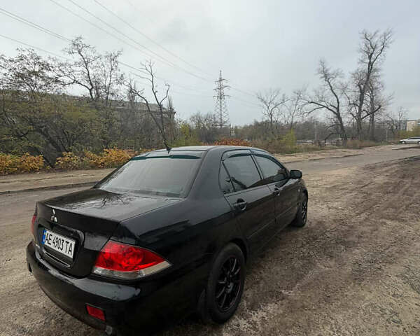 Черный Мицубиси Лансер, объемом двигателя 1.58 л и пробегом 229 тыс. км за 3700 $, фото 1 на Automoto.ua