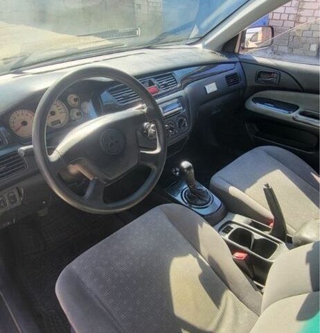 Черный Мицубиси Лансер, объемом двигателя 1.6 л и пробегом 200 тыс. км за 3499 $, фото 5 на Automoto.ua