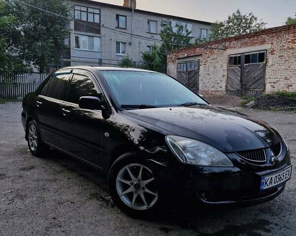 Черный Мицубиси Лансер, объемом двигателя 1.58 л и пробегом 272 тыс. км за 2999 $, фото 1 на Automoto.ua