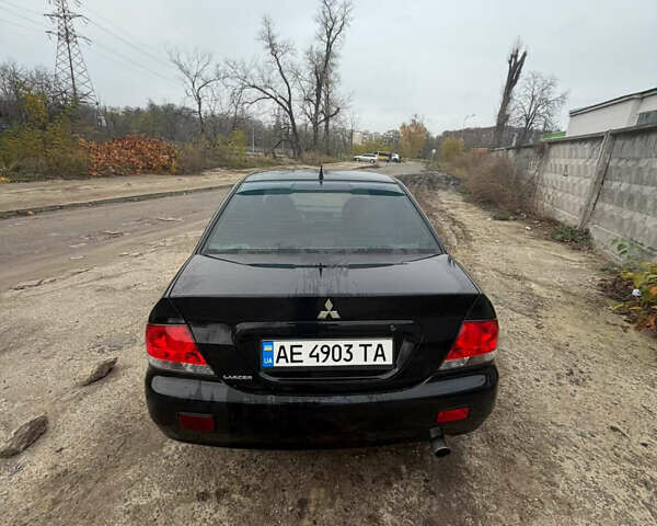 Черный Мицубиси Лансер, объемом двигателя 1.58 л и пробегом 229 тыс. км за 3700 $, фото 2 на Automoto.ua