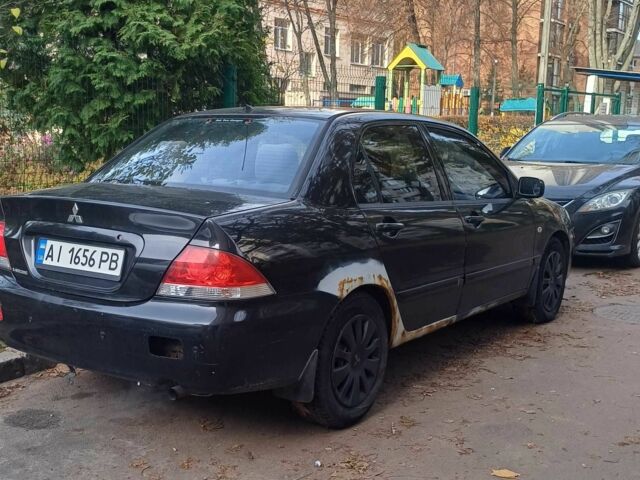 Черный Мицубиси Лансер, объемом двигателя 1.6 л и пробегом 218 тыс. км за 3200 $, фото 3 на Automoto.ua