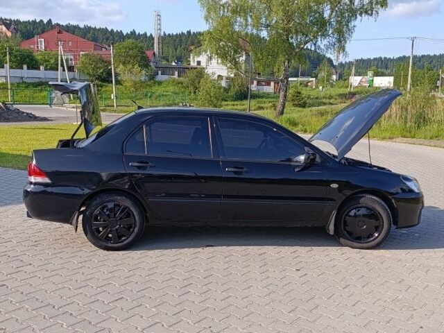 Мицубиси Лансер 2004 в Дрогобыче на Automoto.ua Черный Мицубиси Лансер, объемом двигателя 1.6 л и пробегом 260 тыс. км за 3750 $, фото 11 на Automoto.ua
