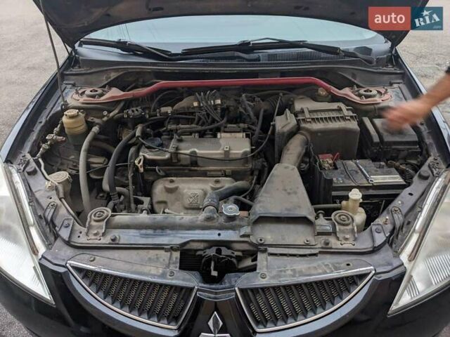 Черный Мицубиси Лансер, объемом двигателя 1.58 л и пробегом 240 тыс. км за 3700 $, фото 13 на Automoto.ua