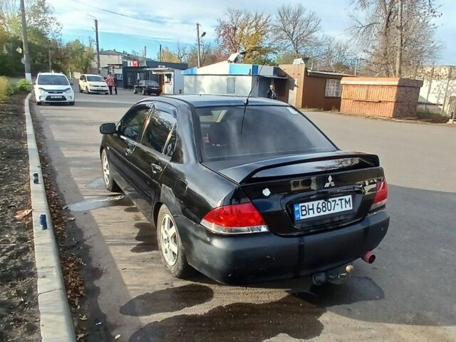 Чорний Міцубісі Lancer, об'ємом двигуна 1.6 л та пробігом 178 тис. км за 2616 $, фото 3 на Automoto.ua