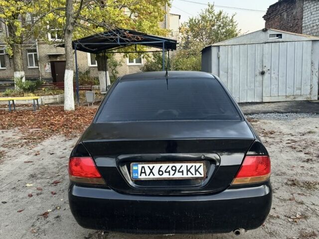 Мицубиси Лансер 2004 в Ивано-Франковске на Automoto.ua Черный Мицубиси Лансер, объемом двигателя 1.6 л и пробегом 280 тыс. км за 2500 $, фото 3 на Automoto.ua
