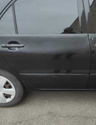 Черный Мицубиси Лансер, объемом двигателя 1.58 л и пробегом 240 тыс. км за 3700 $, фото 4 на Automoto.ua