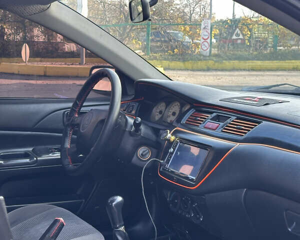 Мицубиси Лансер 2004 в Харькове на Automoto.ua Черный Мицубиси Лансер, объемом двигателя 1.58 л и пробегом 230 тыс. км за 2899 $, фото 6 на Automoto.ua