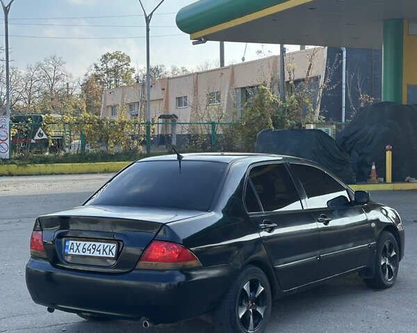 Мицубиси Лансер 2004 в Харькове на Automoto.ua Черный Мицубиси Лансер, объемом двигателя 1.58 л и пробегом 230 тыс. км за 2899 $, фото 4 на Automoto.ua