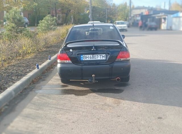 Чорний Міцубісі Lancer, об'ємом двигуна 1.6 л та пробігом 178 тис. км за 2616 $, фото 4 на Automoto.ua