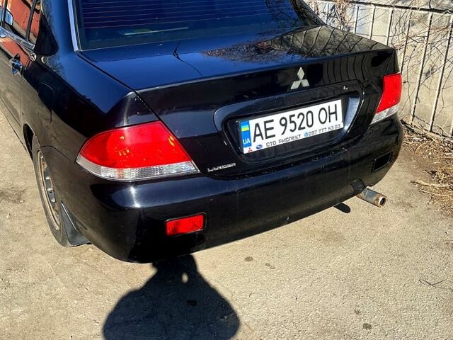 Черный Мицубиси Лансер, объемом двигателя 1.6 л и пробегом 280 тыс. км за 3000 $, фото 1 на Automoto.ua