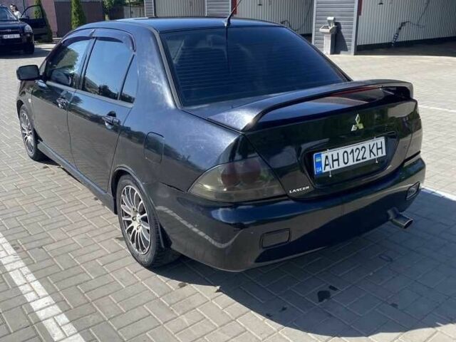 Чорний Міцубісі Lancer, об'ємом двигуна 2 л та пробігом 290 тис. км за 5550 $, фото 2 на Automoto.ua