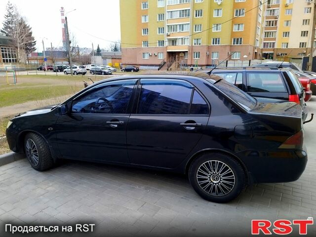 Чорний Міцубісі Lancer, об'ємом двигуна 1.6 л та пробігом 300 тис. км за 4200 $, фото 5 на Automoto.ua