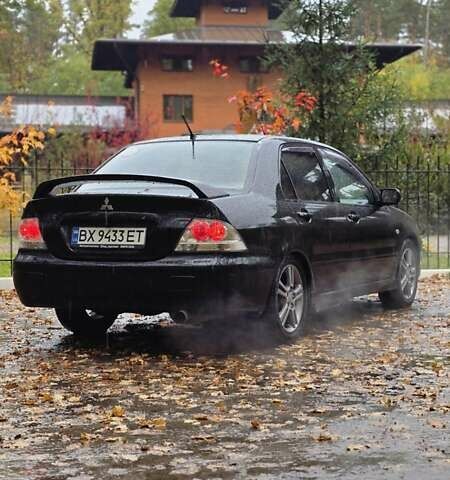 Чорний Міцубісі Lancer, об'ємом двигуна 2 л та пробігом 320 тис. км за 5700 $, фото 1 на Automoto.ua