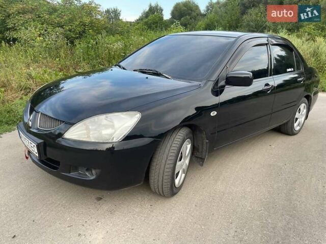 Черный Мицубиси Лансер, объемом двигателя 1.58 л и пробегом 172 тыс. км за 5700 $, фото 2 на Automoto.ua