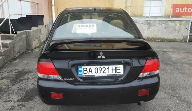 Черный Мицубиси Лансер, объемом двигателя 1.58 л и пробегом 240 тыс. км за 3700 $, фото 8 на Automoto.ua