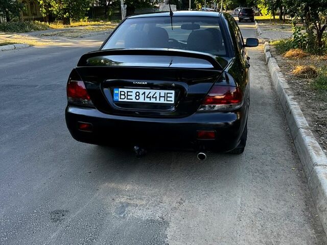 Черный Мицубиси Лансер, объемом двигателя 1.6 л и пробегом 263 тыс. км за 4200 $, фото 1 на Automoto.ua