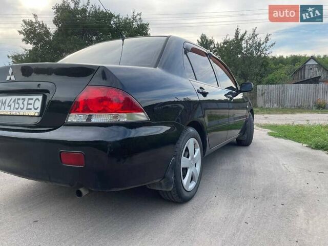 Черный Мицубиси Лансер, объемом двигателя 1.58 л и пробегом 172 тыс. км за 5700 $, фото 4 на Automoto.ua