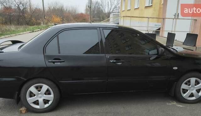 Черный Мицубиси Лансер, объемом двигателя 1.58 л и пробегом 240 тыс. км за 3700 $, фото 3 на Automoto.ua