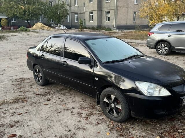 Мицубиси Лансер 2004 в Ивано-Франковске на Automoto.ua Черный Мицубиси Лансер, объемом двигателя 1.6 л и пробегом 280 тыс. км за 2500 $, фото 2 на Automoto.ua