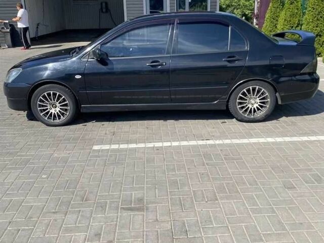 Чорний Міцубісі Lancer, об'ємом двигуна 2 л та пробігом 290 тис. км за 5550 $, фото 1 на Automoto.ua