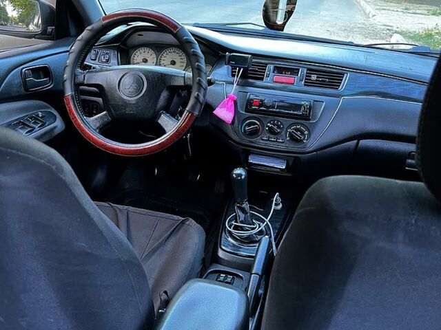 Черный Мицубиси Лансер, объемом двигателя 1.6 л и пробегом 263 тыс. км за 4200 $, фото 2 на Automoto.ua