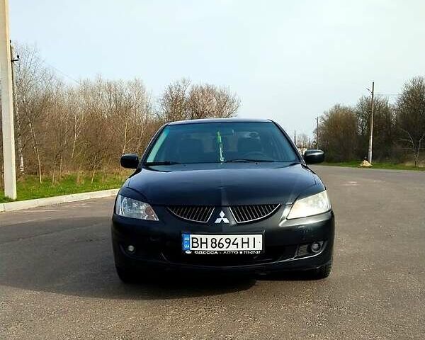 Чорний Міцубісі Lancer, об'ємом двигуна 1.6 л та пробігом 220 тис. км за 5000 $, фото 9 на Automoto.ua