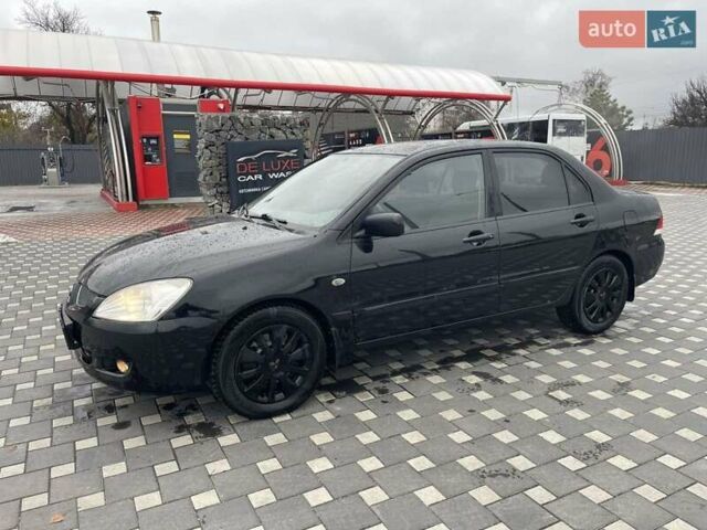 Чорний Міцубісі Lancer, об'ємом двигуна 1.58 л та пробігом 290 тис. км за 3900 $, фото 8 на Automoto.ua
