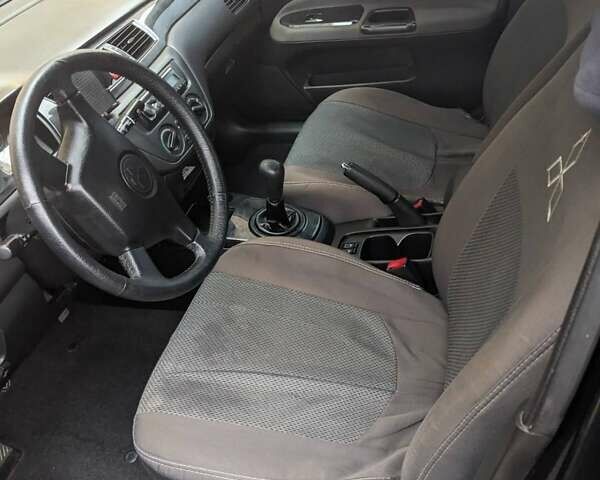 Черный Мицубиси Лансер, объемом двигателя 1.58 л и пробегом 240 тыс. км за 3700 $, фото 14 на Automoto.ua