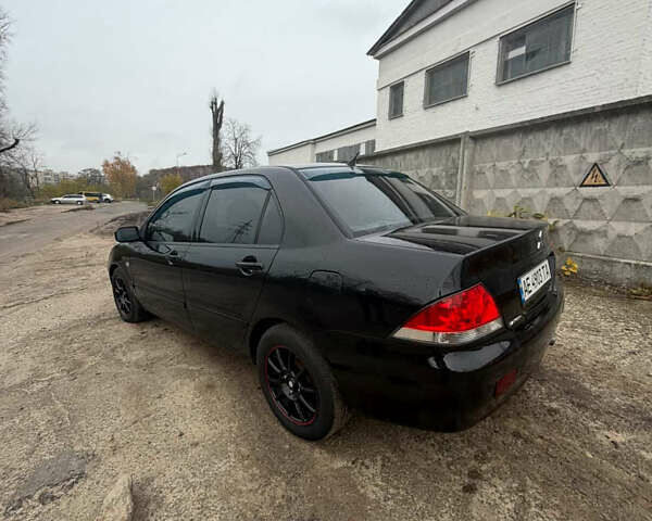 Черный Мицубиси Лансер, объемом двигателя 1.58 л и пробегом 229 тыс. км за 3700 $, фото 3 на Automoto.ua