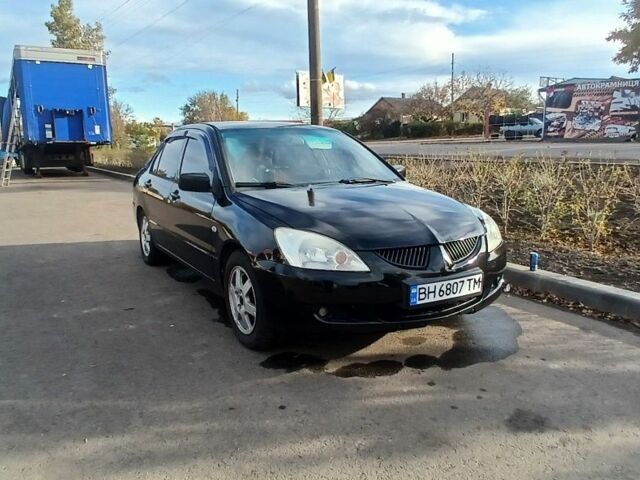 Чорний Міцубісі Lancer, об'ємом двигуна 1.6 л та пробігом 178 тис. км за 2616 $, фото 1 на Automoto.ua