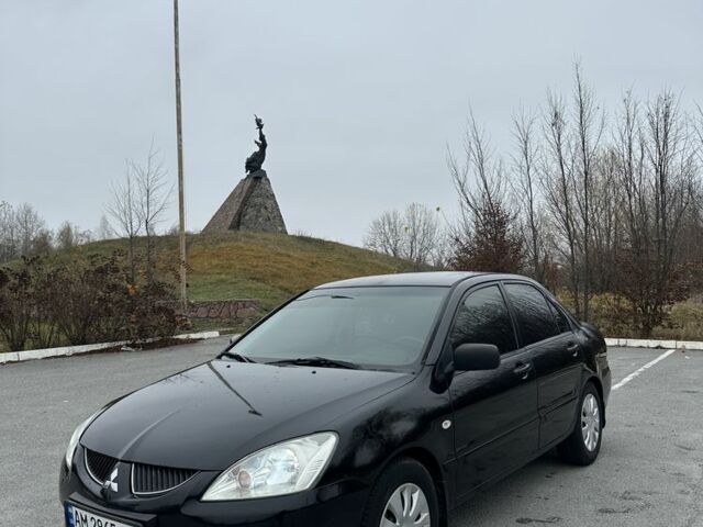 Черный Мицубиси Лансер, объемом двигателя 1.6 л и пробегом 200 тыс. км за 3500 $, фото 1 на Automoto.ua