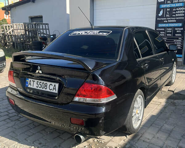 Мицубиси Лансер 2005 в Ивано-Франковске на Automoto.ua Черный Мицубиси Лансер, объемом двигателя 1.58 л и пробегом 250 тыс. км за 5000 $, фото 2 на Automoto.ua