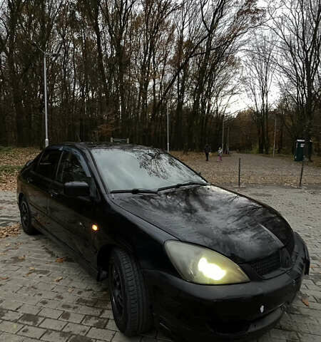 Черный Мицубиси Лансер, объемом двигателя 1.6 л и пробегом 200 тыс. км за 3000 $, фото 5 на Automoto.ua