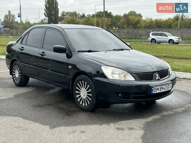 Чорний Міцубісі Lancer, об'ємом двигуна 1.58 л та пробігом 390 тис. км за 4500 $, фото 1 на Automoto.ua