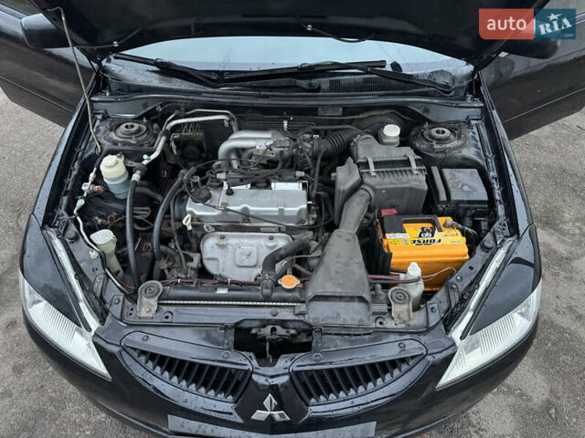 Черный Мицубиси Лансер, объемом двигателя 1.58 л и пробегом 154 тыс. км за 5500 $, фото 21 на Automoto.ua