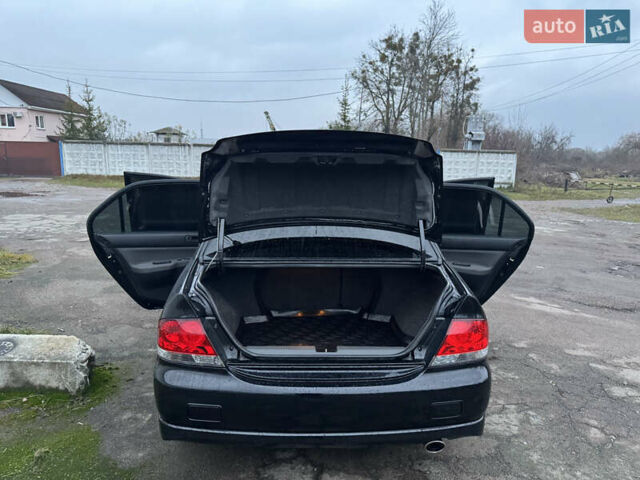 Черный Мицубиси Лансер, объемом двигателя 1.58 л и пробегом 154 тыс. км за 5500 $, фото 16 на Automoto.ua