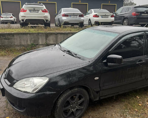 Черный Мицубиси Лансер, объемом двигателя 1.58 л и пробегом 264 тыс. км за 4600 $, фото 4 на Automoto.ua