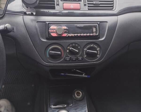 Міцубісі Lancer 2005 у Запоріжжя на Automoto.ua Чорний Міцубісі Lancer, об'ємом двигуна 1.58 л та пробігом 186 тис. км за 4700 $, фото 7 на Automoto.ua