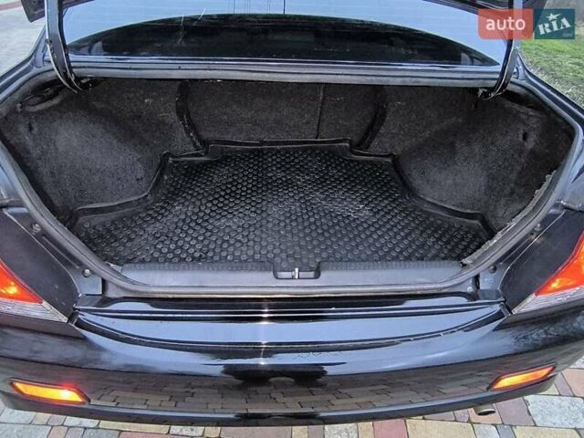 Чорний Міцубісі Lancer, об'ємом двигуна 1.58 л та пробігом 263 тис. км за 4500 $, фото 15 на Automoto.ua