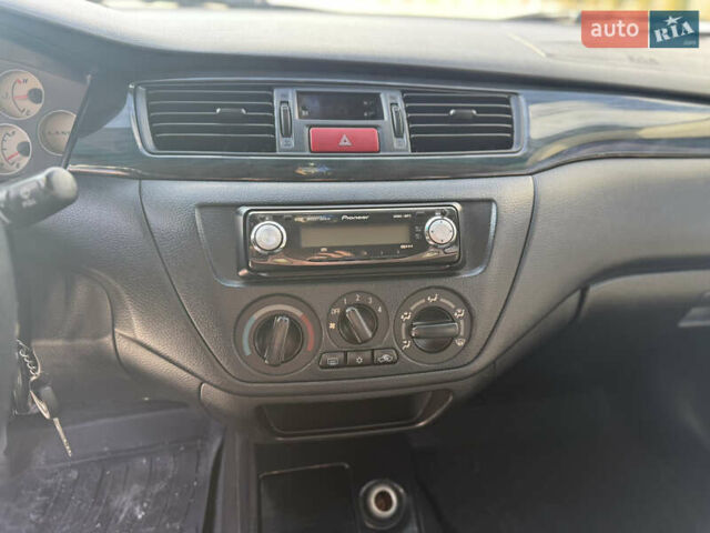 Чорний Міцубісі Lancer, об'ємом двигуна 1.6 л та пробігом 205 тис. км за 3650 $, фото 11 на Automoto.ua
