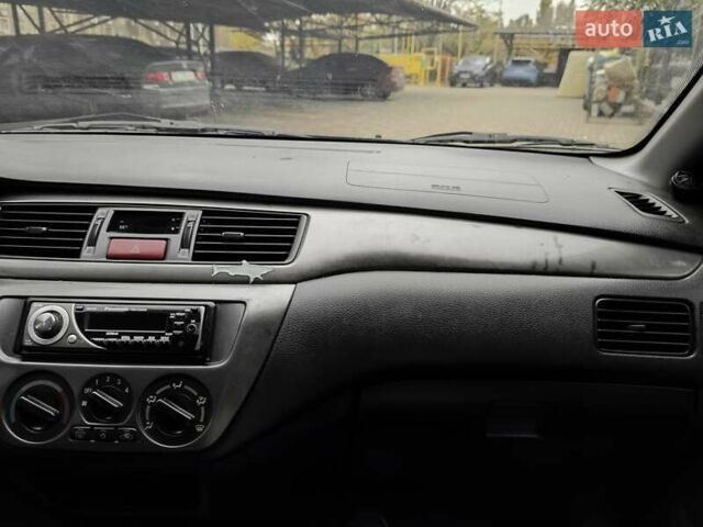 Мицубиси Лансер 2005 в Одессе на Automoto.ua Черный Мицубиси Лансер, объемом двигателя 1.58 л и пробегом 206 тыс. км за 3900 $, фото 17 на Automoto.ua