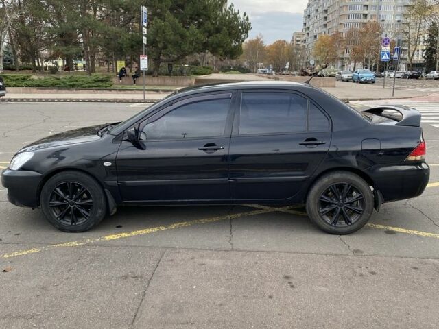 Черный Мицубиси Лансер, объемом двигателя 1.6 л и пробегом 350 тыс. км за 2900 $, фото 6 на Automoto.ua